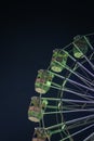 Giant ferris wheel with green lighting in An Exhibition indian Fair at night Royalty Free Stock Photo