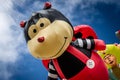 Giant flying ladybird cartoon character kite at the Summer Southsea kite festival, Portsmouth, UK Royalty Free Stock Photo