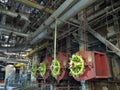 Giant gas-burners, glitter tubes, equipment, cables and piping inside a modern industrial power plant Royalty Free Stock Photo