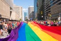 Giant gay rainbow flag over the street at gay pride parade Royalty Free Stock Photo