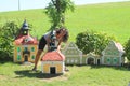 Giant girl behind belfry in Minimodel of South Bohemian village