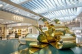 Giant golden artificial ribbon at duty-free shops area