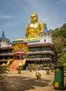 Giant golden Buddha at the entrance to Dambulla Caves in Sri Lanka Royalty Free Stock Photo