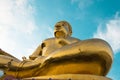 Giant Golden Buddha statue with blue sky Thailand