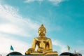 Giant Golden Buddha statue with blue sky Thailand Royalty Free Stock Photo