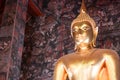 Giant golden Buddha statue front Thai acient art living style in Buddhist temple., Bangkok, Thailand Royalty Free Stock Photo