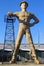 Giant Golden Driller Statue and landmark of oilfield worker and oil derrick near Route 66 in Tulsa Oklahoma