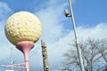 Giant Golf Ball Shaped Sign On Street Post