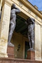 Giant granite statue of Atlantes of Hermitage museum portico in Saint Petersburg, Russia