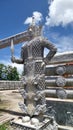 Giant the guardian sculpture under blue sky