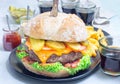 Giant homemade cheeseburger for burger party, horizontal Royalty Free Stock Photo