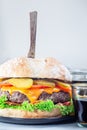 Giant homemade cheeseburger for burger party, vertical Royalty Free Stock Photo