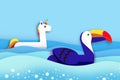 Giant inflatable Fantasy Unicorn and Toucan paper cut style. Origami Pool float toys. Crystal clear blue sea water
