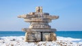 A giant Inukshuk stands overlooking Georgian Bay at Collingwood`s Sunset Point Park