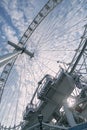 Giant iron wheel with a cloudy sky at the background wellknown as London Eye