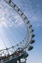 Giant iron wheel with a cloudy sky at the background wellknown as London Eye