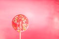 Giant lollipop on a pink background