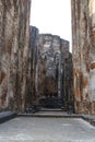 A giant masoned standing Buddha statue without head in a temple in the royal ancient city of Polonnaruwa in Sri Lanka Royalty Free Stock Photo