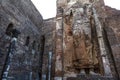 A giant masoned standing Buddha statue without head in a temple in the royal ancient city of Polonnaruwa in Sri Lanka Royalty Free Stock Photo