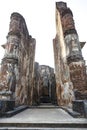 A giant masoned standing Buddha statue without head in a temple in the royal ancient city of Polonnaruwa in Sri Lanka Royalty Free Stock Photo