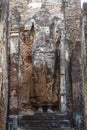 A giant masoned standing Buddha statue without head in a temple in the royal ancient city of Polonnaruwa in Sri Lanka Royalty Free Stock Photo