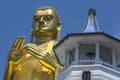 The giant 30 metre high golden statue of Buddha at the Golden Temple in Dambulla in Sri Lanka. Royalty Free Stock Photo