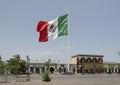 Giant Mexican flag flying in the breeze in the main square of San Jose del Cabo.