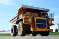 Giant mining dump truck, after being discharged from the conveyor, is tested at the factory test site.