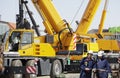 Giant mobile cranes and building workers Royalty Free Stock Photo