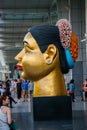 Giant model of a Thai womans head, near big mall Royalty Free Stock Photo