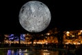 Giant Moon in the city center by night