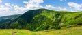 Giant Mountains, mountain panorama from the hiking trail to the top of Sniezka. View of the vast mountain slopes and trails Royalty Free Stock Photo