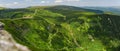 Giant Mountains, mountain panorama from the hiking trail to the top of Sniezka. View of the vast mountain slopes and trails Royalty Free Stock Photo