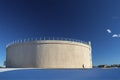 Giant Municipal City Water Tank on a Sunny, Clear Day with Snow