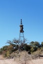 Baya birds colony on an old wind wheel pole