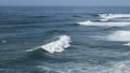 Giant ocean waves crash on the water surface forming a rainbow Royalty Free Stock Photo