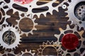 GIANT OLD AND RUSTY COGWHEELS WITH WOODEN BACKGROUND
