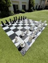 Giant Outdoor Chess Set on Lawn Seen at an Oblique Angle (Vertical )