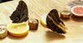 Giant owl eye butterfly feeding on the slices of orange