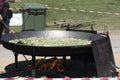 Giant paella in the process of adding the vegetables Royalty Free Stock Photo