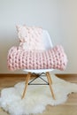 Giant Pink Blanket Woolen Knitted on White Wooden Stool Chair Royalty Free Stock Photo