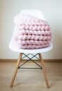 Giant Pink Plaid Blanket Woolen Knitted on White Wooden Stool Chair Home Royalty Free Stock Photo