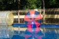 Giant plastic zorbing balloons floating on water in park