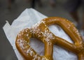 Giant pretzel from a New York street vendor in Wax Paper Royalty Free Stock Photo