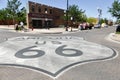 Giant Route 66 Sign on The Road. Standing on a Corner In Winslow Arizona.