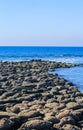 Giant`s Causeway in St. Martin`s Island, Bangladesh. Magical sunrise, clouds, and waves hitting the coast.