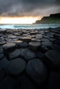 Giant`s Causeway with waves at sunrise Royalty Free Stock Photo