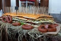 Giant sandwich and smoked sausage on a cart at a beer festival