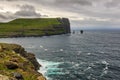 Giant sea cliff and sea stacks on Faroe Islands Royalty Free Stock Photo