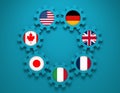 Giant seven members national flags on gears Royalty Free Stock Photo